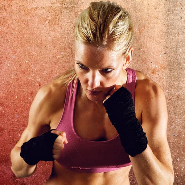 Mixed Martial Arts Lessons for Adults in Garner NC - Lady Kickboxing Focused Background