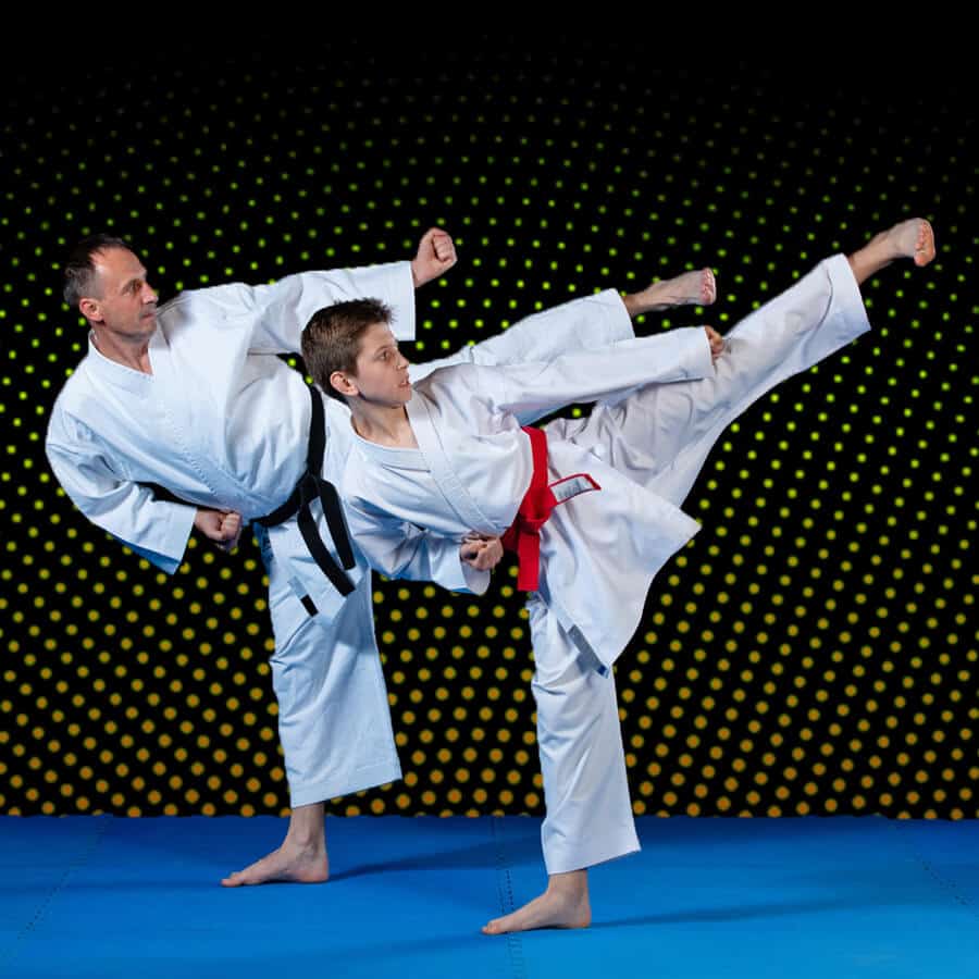 Martial Arts Lessons for Families in Garner NC - Dad and Son High Kick